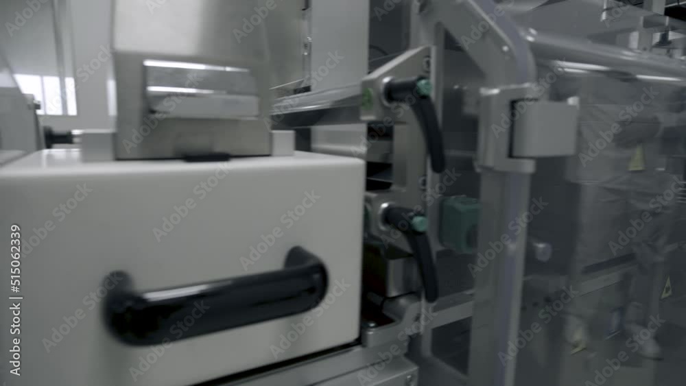 Photo sensor detect medicine bottles on line conveyor in pharmaceutical industry. Industrial Machine for quality of medical product in line conveyor processing. Industrial and technology concept.
