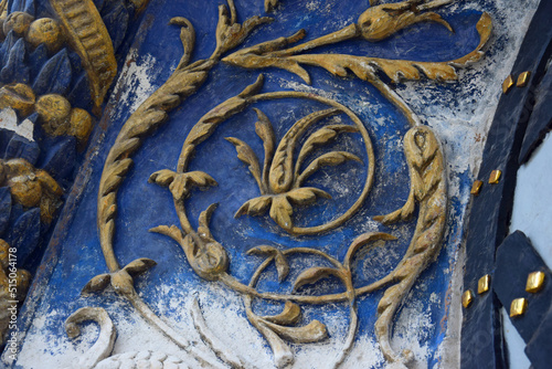 A fragment of a beautiful bas-relief with a floral ornament on the arch above the entrance. Side portal of the northern facade Cathedral of the Archangel (Moscow Kremlin)