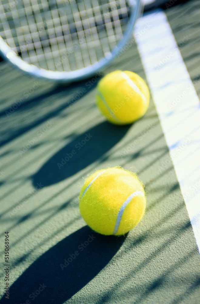 tennis racket and ball on court