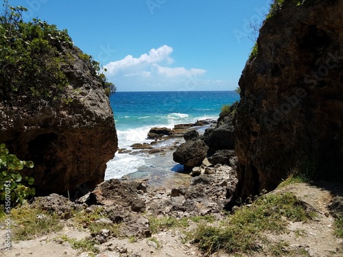 ocean water at Guajataca beach in Isabela Puerto Rico with rocks photo