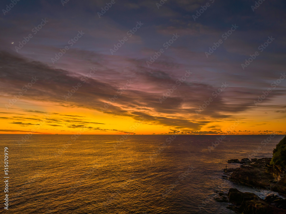 Fototapeta premium Sunrise over the sea with high cloud