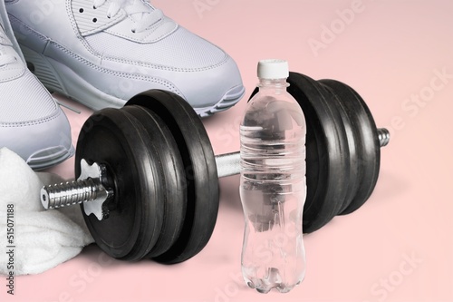 Fototapeta Naklejka Na Ścianę i Meble -  Female fitness sneakers, dumbbells. Feminine sports, workouts, healthy lifestyle.