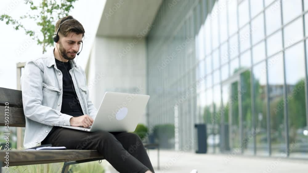 Ethnic businessman speaking looking at laptop computer, online conference distance office chat, virtual training concept. Caucasian business man wearing headphones communicating by video call Ethnic businessman speaking looking at laptop computer, online conference distance office chat, virtual training concept. Caucasian business man wearing headphones communicating by video call