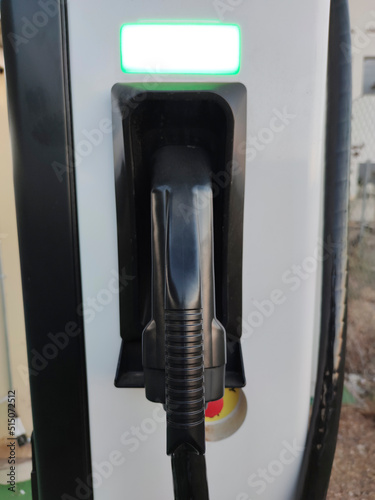 Vehicle connector at electric car charging station