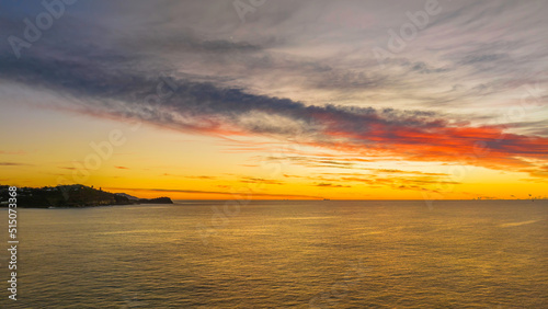 Sunrise over the sea with high cloud