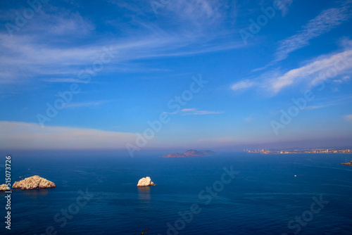 pacific ocean with islands and beautiful blue water sky with some clouds and coast on mazatlan sinaloa  photo