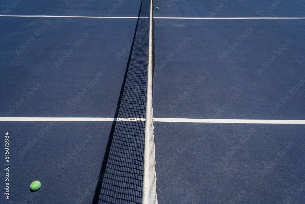 Empty blue tennis court and net