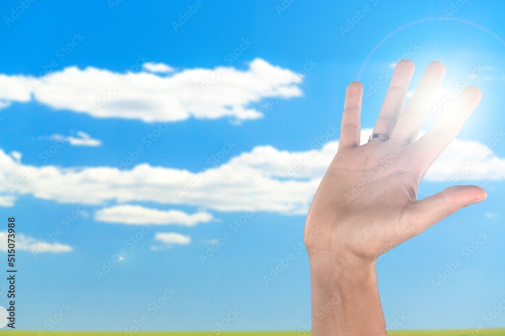 Human hand to sun on sky background Human hand to sun on sky background