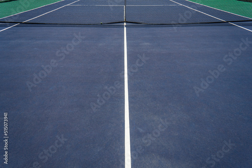 Empty blue tennis court and net
