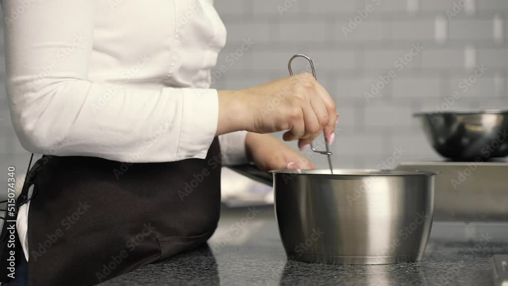 young girl chef makes desserts. bakes sweets and cakes. makes blanks and prepares fruits for the filling. baking, dessert, sweets, complex cooking processes. young girl chef makes desserts. bakes sweets and cakes. makes blanks and prepares fruits for the filling. baking, dessert, sweets, complex cooking processes.