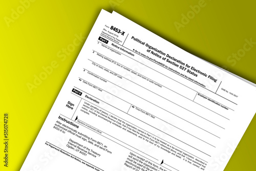 Form 8453-X documentation published IRS USA 43747. American tax document on colored