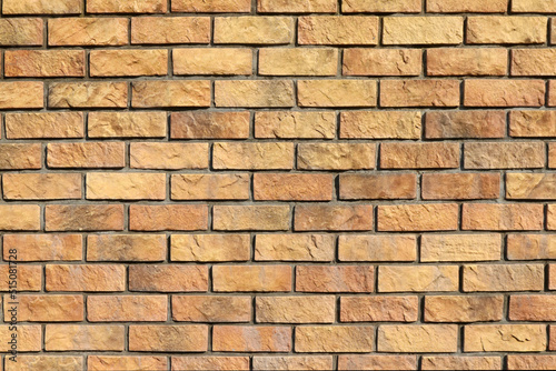 Antique rock style, yellow and brown brick wall texture. Flat photograph for architectural CG rendering and perspective drawings. 明るい茶色のレンガ塀のテクスチャー。