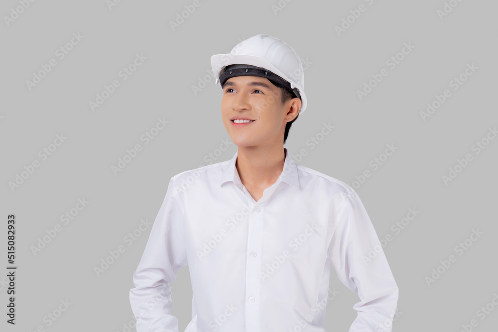 Portrait young asian man is engineer wearing helmet standing and smiling with confident isolated on white background, handsome male is architect or contractor, worker or labor, industrial concept. Portrait young asian man is engineer wearing helmet standing and smiling with confident isolated on white background, handsome male is architect or contractor, worker or labor, industrial concept.