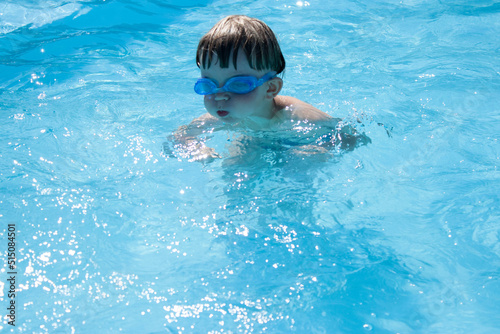 outdoor swimming pool boy with swimming glasses
