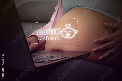 Concept maternity, pregnant woman watching on laptop loading bars 8 months