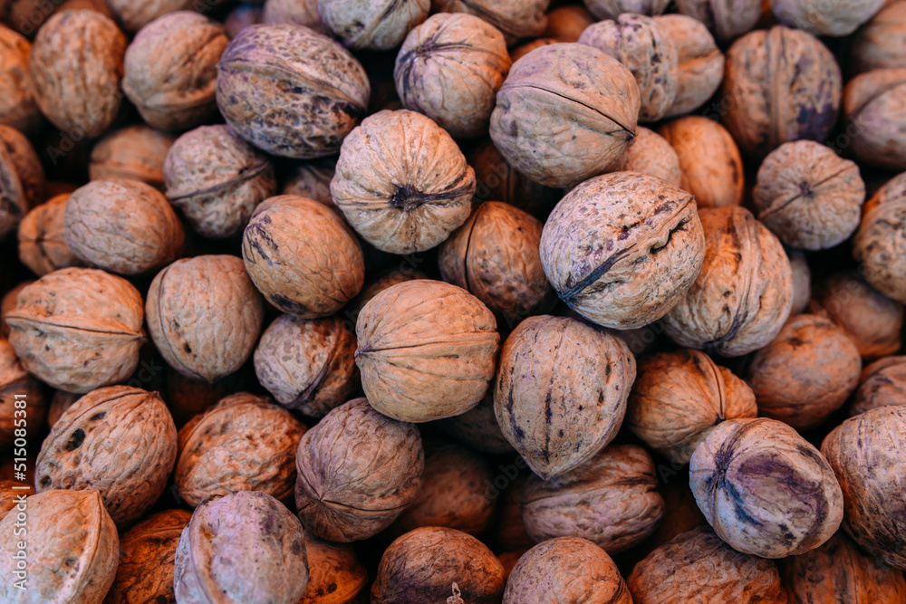 Lots of walnuts at the farmers market counter Lots of walnuts at the farmers market counter