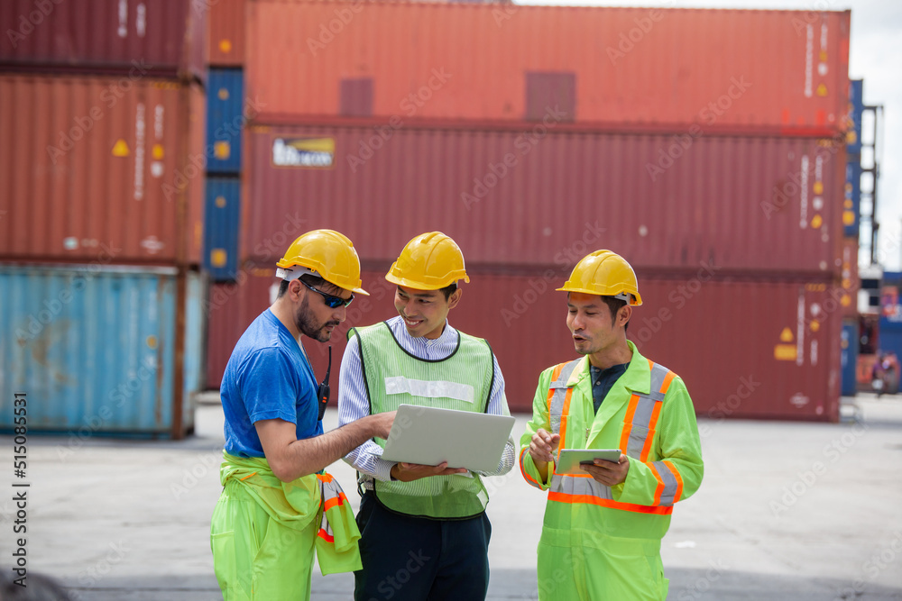 Manager standing and meeting with his staff in container depo company
