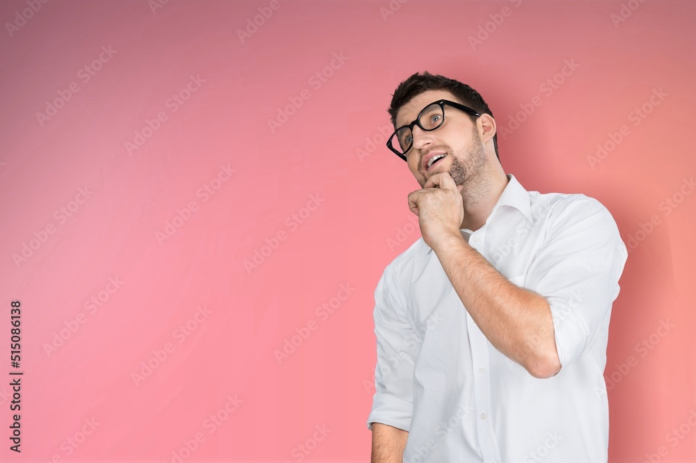 Overjoyed man carefree guy posing on a background