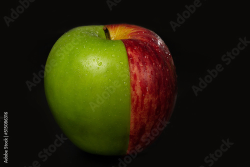 Half green apple and half red apple.