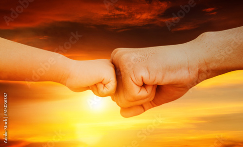 Image close up Father and son's hands touched with love in their fists : Teaching sons to be strong concept.