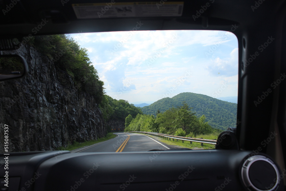 driving on a highway mountains jeep driving on a highway mountains jeep