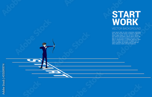 Businessman in suit shoot the arrow from start line. Concept of start business and ready to shoot.