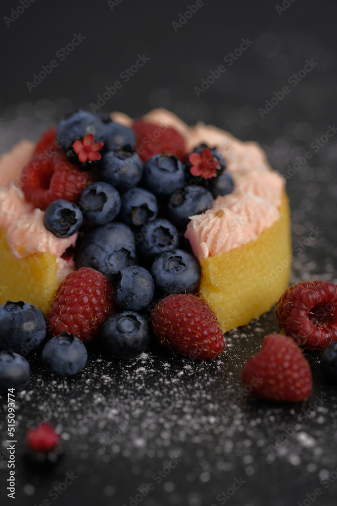 Cake with cream covered with juicy berries. Cake with cream covered with juicy berries.