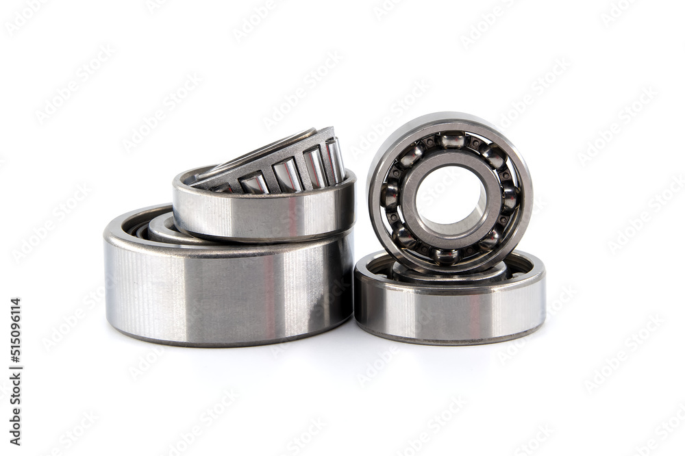 Set of various ball and roller bearings on white Set of various ball and roller bearings on white