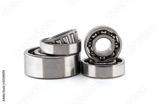 Set of various ball and roller bearings on white