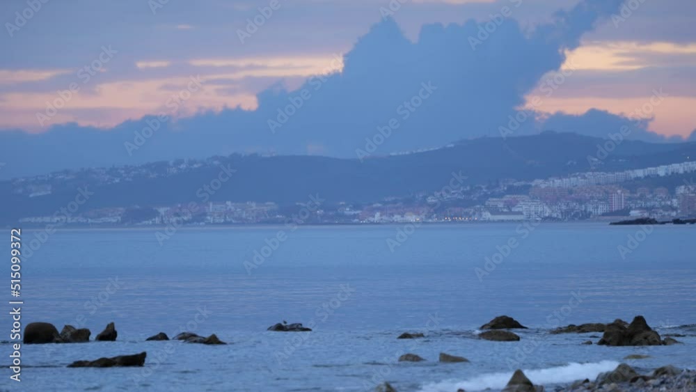 Waves Splashing On Rocky Shore In Costa del Sol, Spain - wide shot
