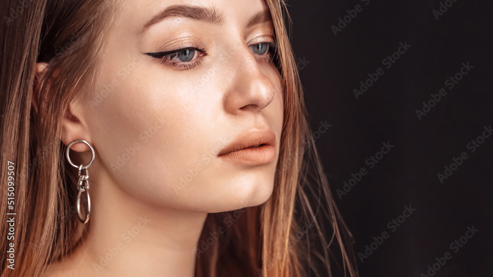 Profile of a beautiful woman with flawless blue eyes dark hair Profile of a beautiful woman with flawless blue eyes dark hair