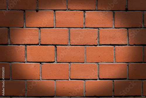 Red brick wall with dark vignette. Copy space for your design. Web banner.  photo