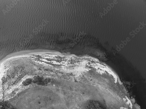 Eungella Dam Queensland Australia with low water levels showing texture in the and pattern in the shallows. photo