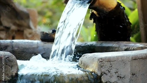 close up view pump pipe water flow equipment agriculture,water flowing to tap in the big water tank, tubewell - freshwate