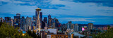 Sunset skyline panorama with the Space Needle and Mount Rainier in Seattle, WA