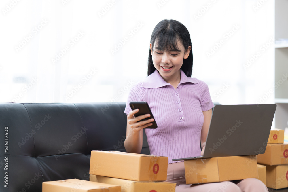 Starting small businesses SME owners female entrepreneurs check online orders to prepare to pack the boxes, sell to customers, sme business ideas online. Starting small businesses SME owners female entrepreneurs check online orders to prepare to pack the boxes, sell to customers, sme business ideas online.