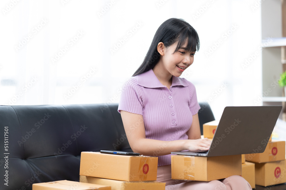 Starting small businesses SME owners female entrepreneurs check online orders to prepare to pack the boxes, sell to customers, sme business ideas online. Starting small businesses SME owners female entrepreneurs check online orders to prepare to pack the boxes, sell to customers, sme business ideas online.