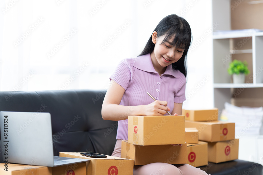 Starting small businesses SME owners female entrepreneurs check online orders to prepare to pack the boxes, sell to customers, sme business ideas online.
