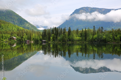 Green scenery and reflections on lake Odensee in Pichl Kainisch, Bad Aussee, Salzkammergut, Styria, Austria, Europe. The Odensee is a natural lake surrounded by a nature reserve