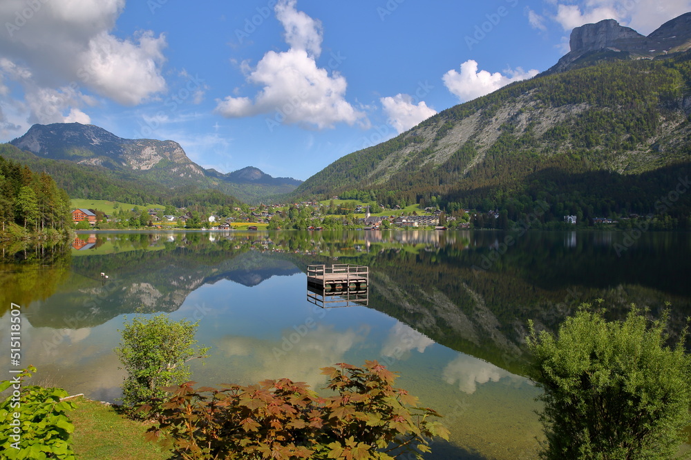 Reflections on the lake Altaussee viewed from the shore, Bad Aussee, Salzkammergut, Styria, Austria, Europe, with the town of Altaussee and Loser mountain in the background