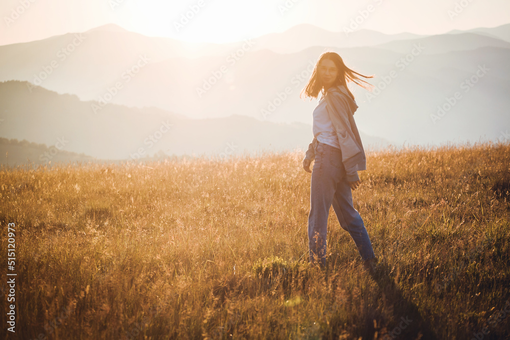Pretty Teen Girl in Golden Mountain Sunrise Landscape