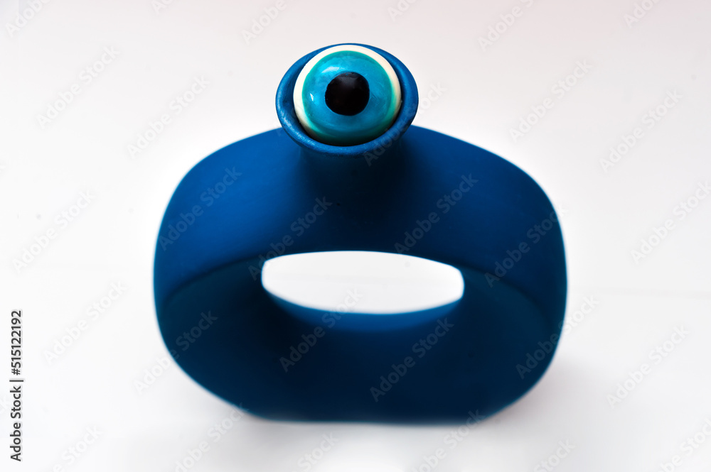 blue eye against a blue vase. Halloween concept. copy space