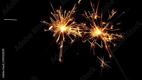 sparkler celebrating new year at night on black background
