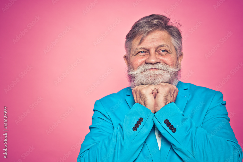 Funny hipster senior man with mustache and beard modeling during a photoshooting. Funny hipster senior man with mustache and beard modeling during a photoshooting.