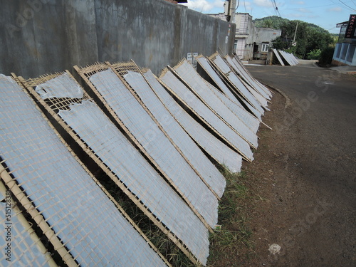 rice noodles production in traditional way and drying out at the sun in small vietnamesse village,Vietnam,Asia,noodle production,traditional,panorama,sun photo