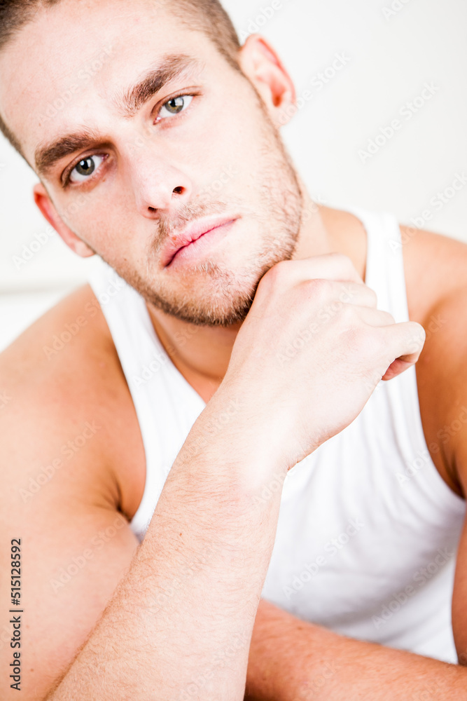 Vested Portrait. A confident look on the face of an athletic male model. From a series of images with the same models. Vested Portrait. A confident look on the face of an athletic male model. From a series of images with the same models.