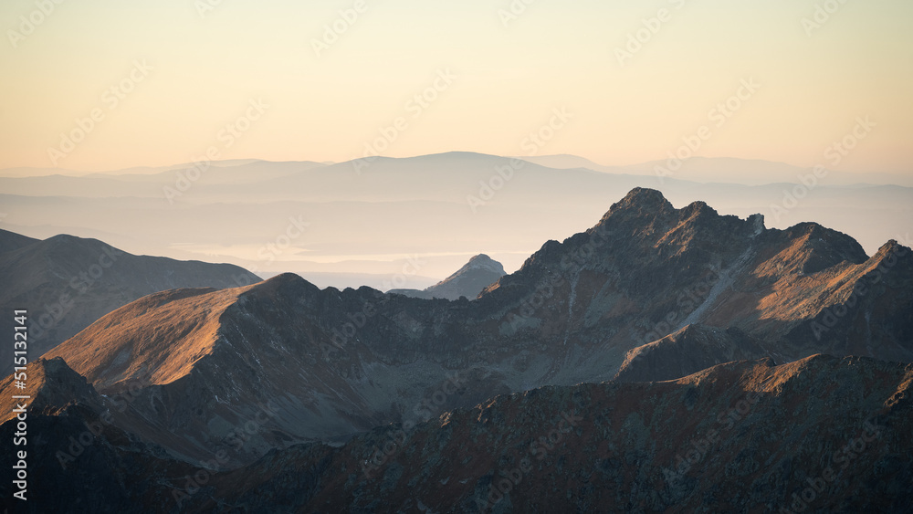 Alpine landscape with mountain ranges, peaks catching last light during sunset, Europe, Slovakia