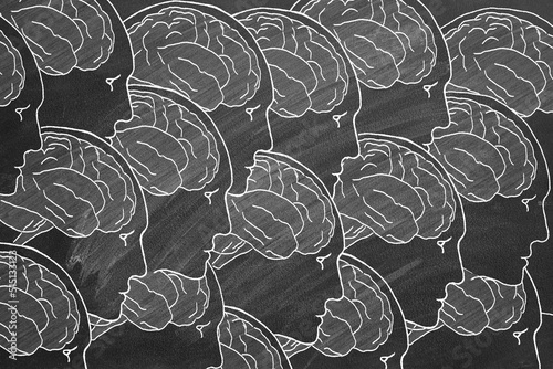 Human Heads and Brain. Hand drawn Illustration on blackboard. The concept of human creativity and collective mind. Idea, Analysis, Brainstorm, Success. photo