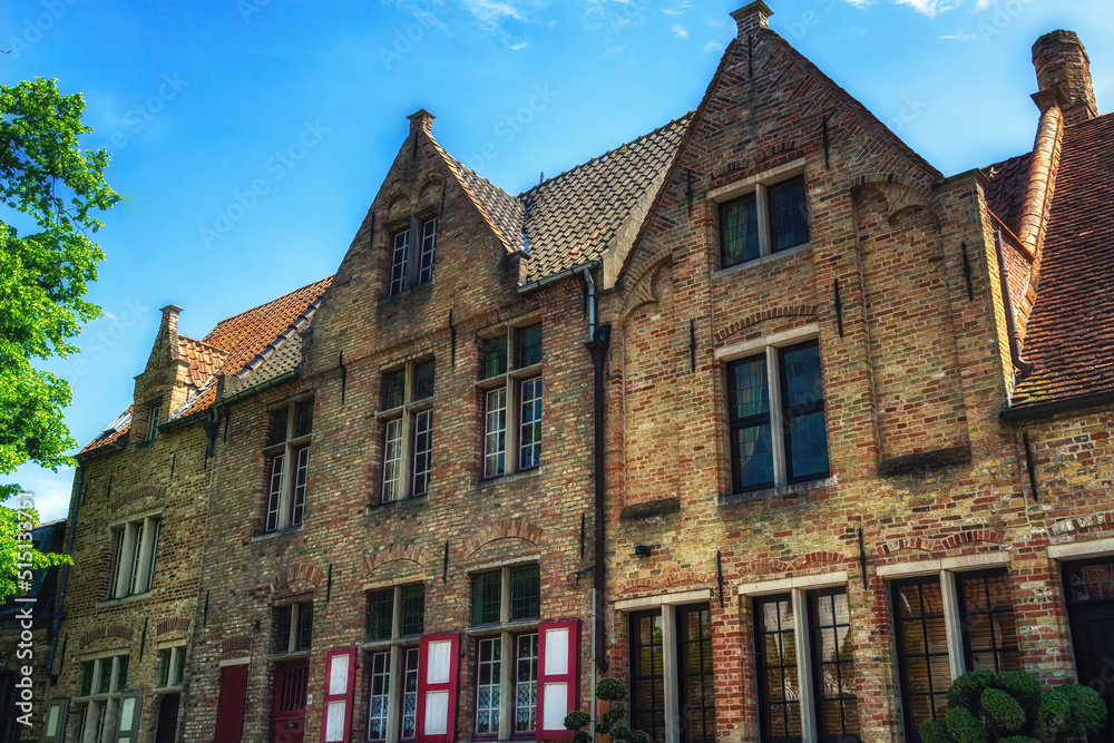 Fototapeta premium Several historical red houses in Bruges, Belgium