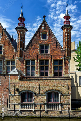 Several historical red houses in Bruges, Belgium